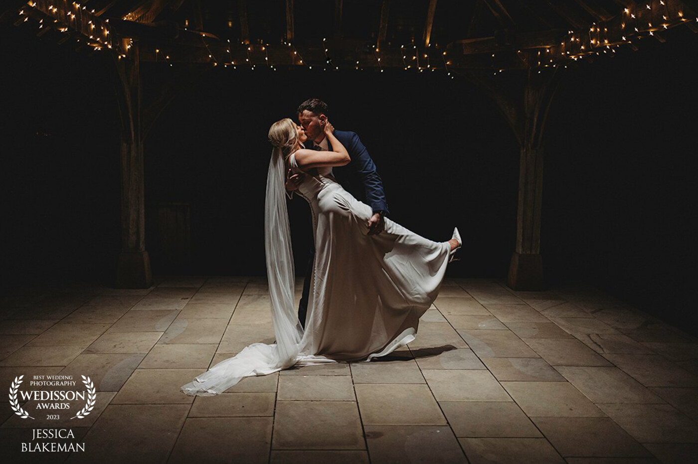 A truly beautiful day at Sandhole Oak Barn ended with an evening dance under the spotlight. I noticed how the light interacted with the couple, creating shadows and shapes on the Brides dress as they embraced.