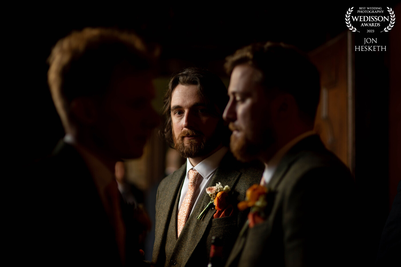 The lighting at this moment with the groomsmen all pensive before walking down the aisle, I was lucky enough to turn around and capture this perfect moment in time.