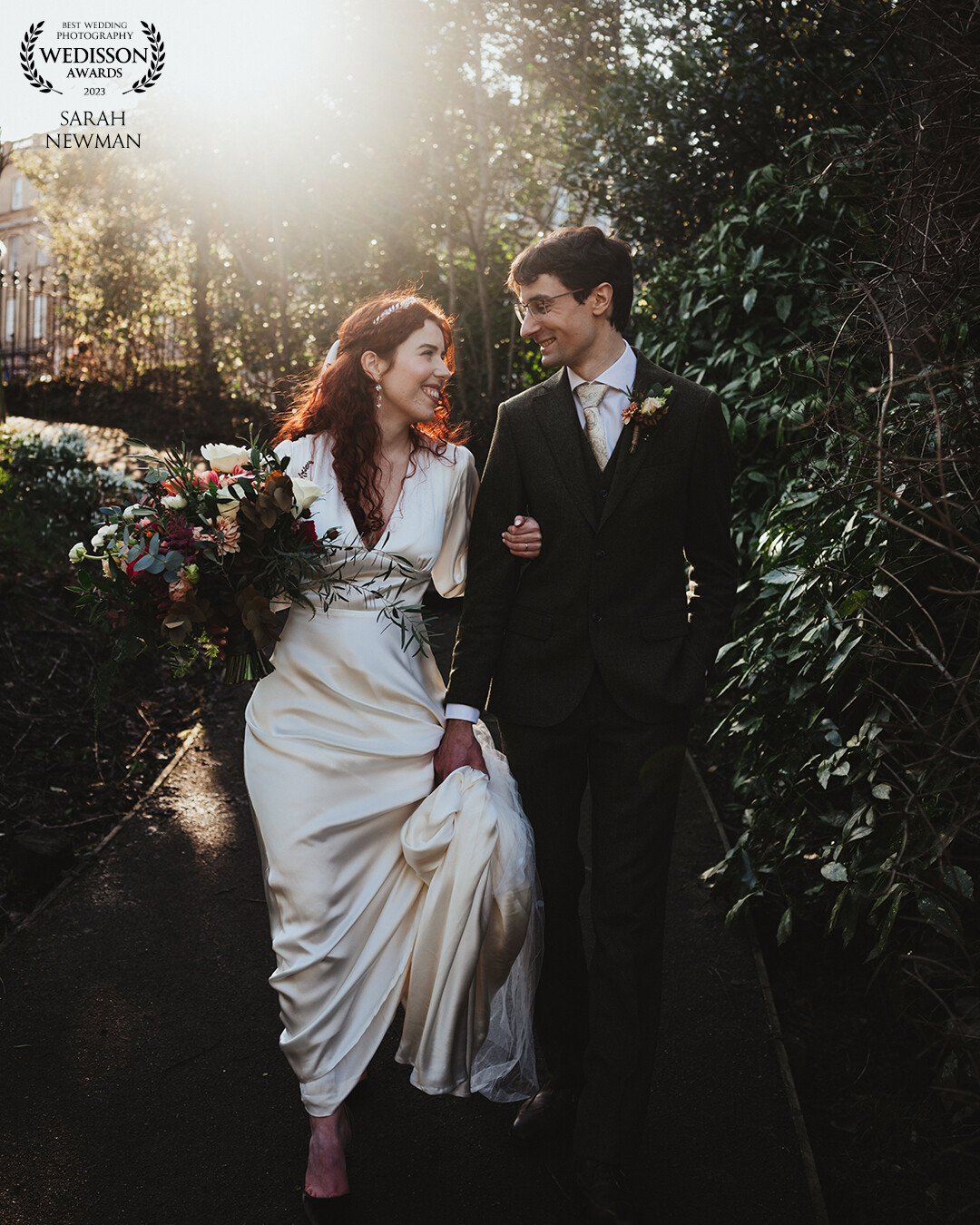 Margaux and Dennis from their wedding at The Royal College of Physicians in Edinburgh, taking a stroll for photos in Queen Street private gardens during sunset!