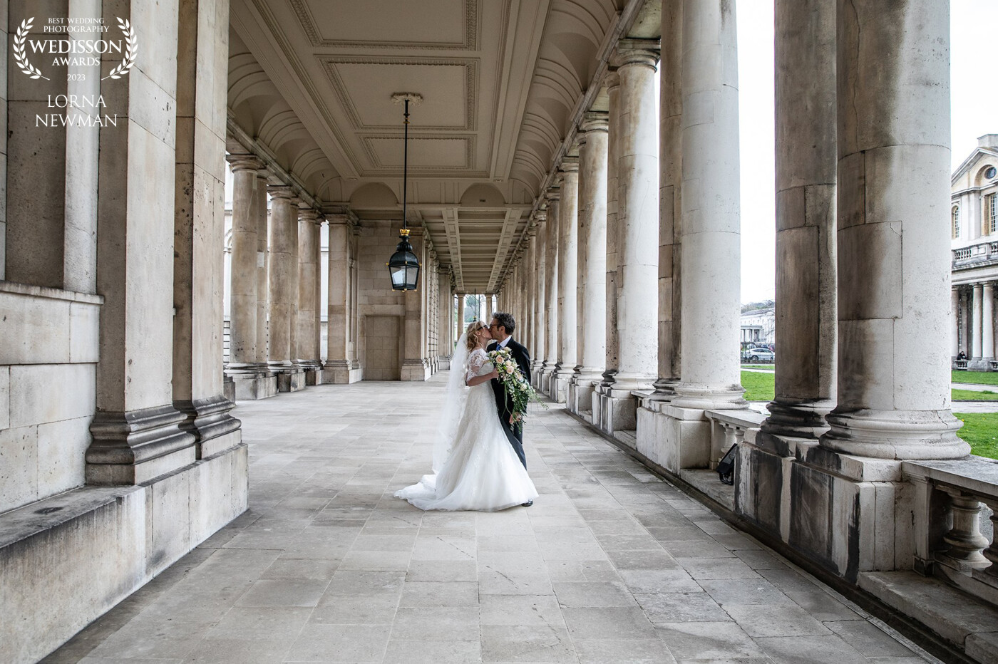 Annie & Geoff outside the Old Royal Naval College in Greenwich, London. They were more than happy to have a kiss during their wedding photographs, and I did not see them stop smiling all day. How could you not in these stunning surroundings. Congratultions Annie & Geoff.