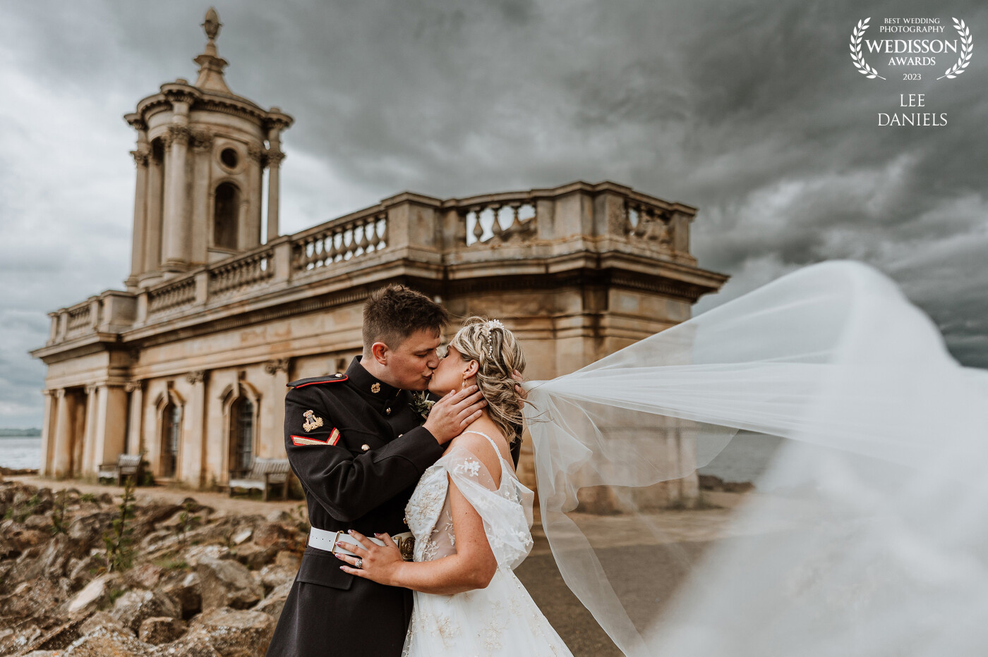 Samantha & Lucas during their dream wedding at Normanton Church in Rutland, what's not to love about a moody sky and a veil flowing in the breeze