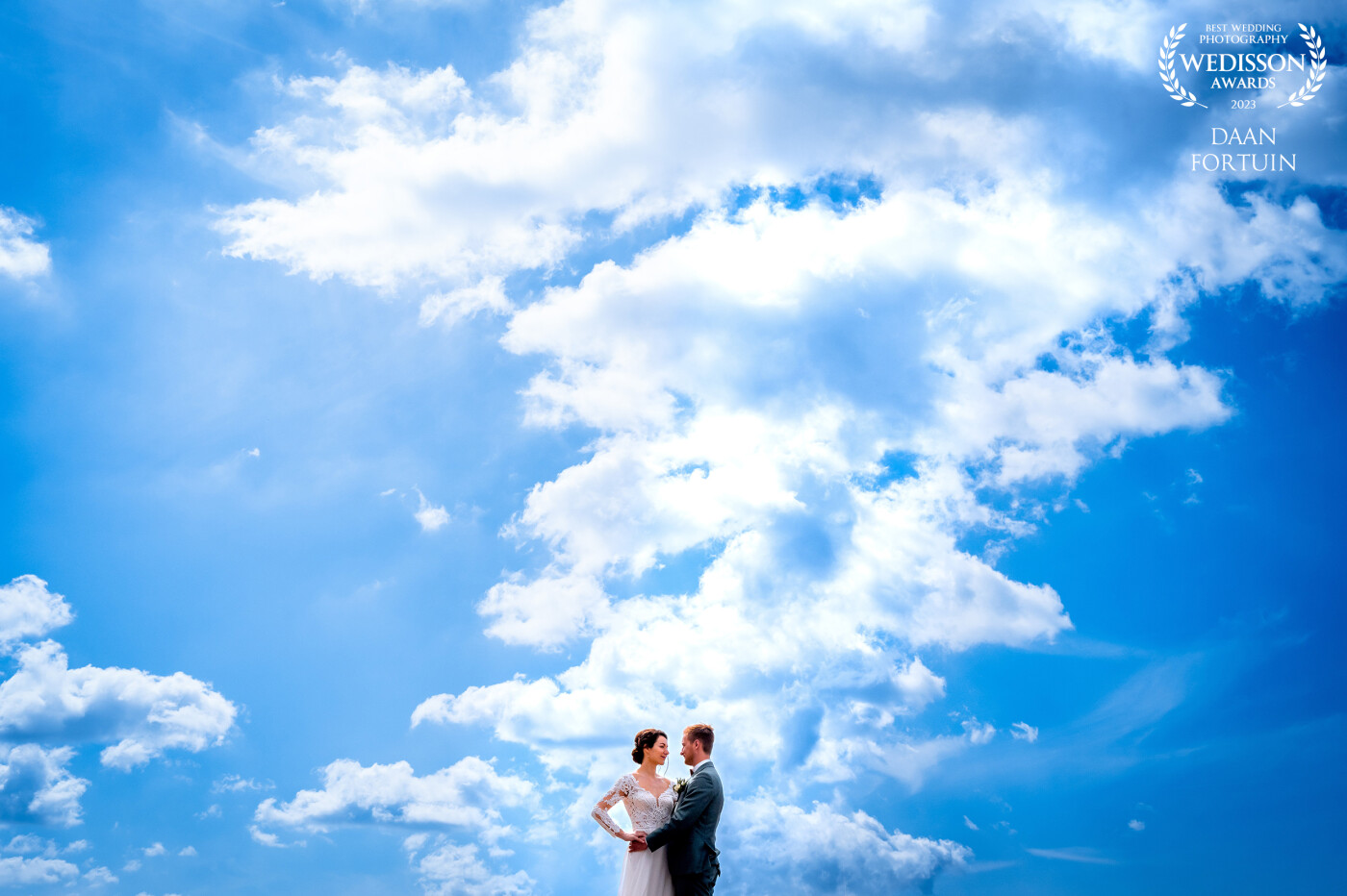 this photo was taken at Naturals a Dutch museum.. We where just taking a break in the fresh air .. when I saw these beautiful clouds so I took advantage of it and put the bridal couple on a table to remove background noise.. this was the result ;)