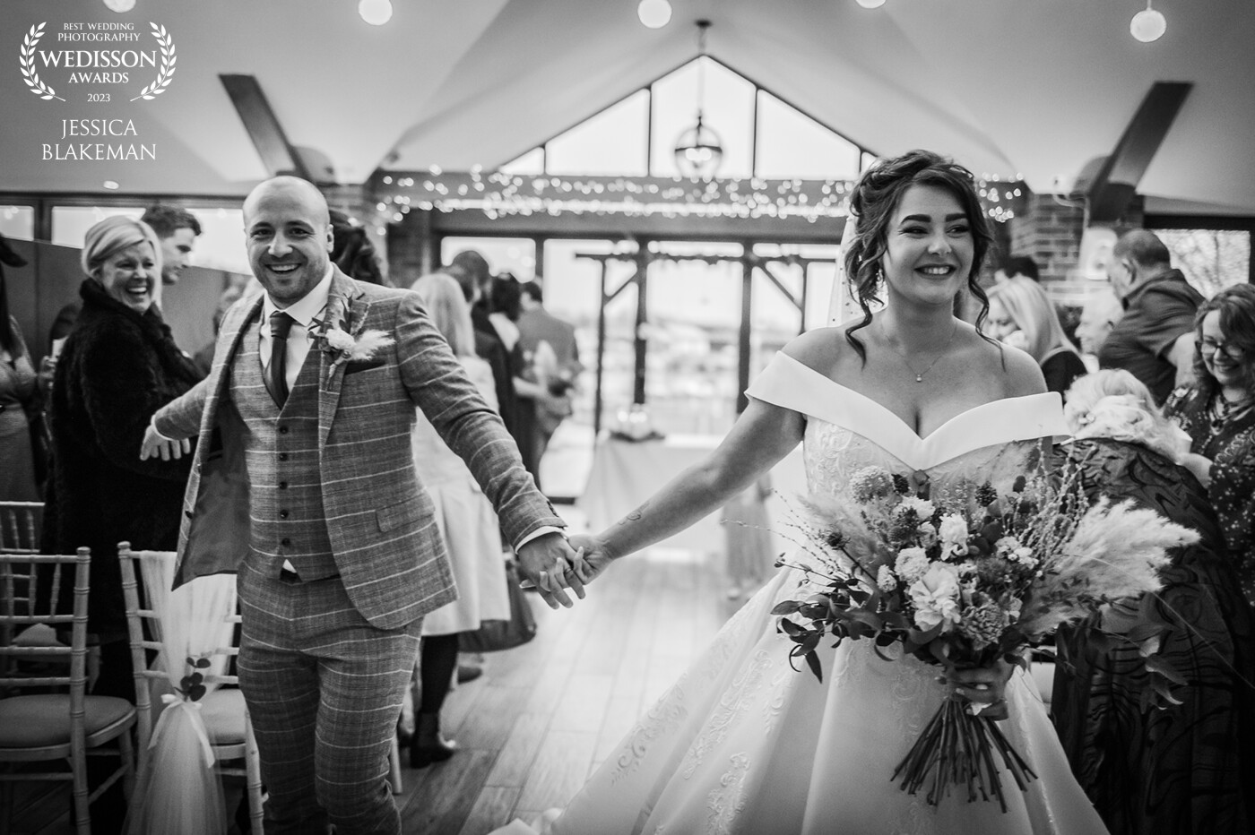 Is there anything better than that just married feeling? Erin and Lee were certainly full of smiles on their way down the aisle after saying "I do"