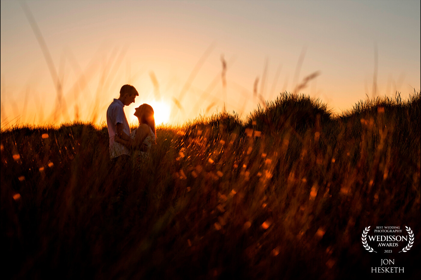 Talacre Beach had been amazing for me this year for sunset shoots, with the sun setting I placed my couple in-front of the sun and the light bounced beautifully off the long grass.