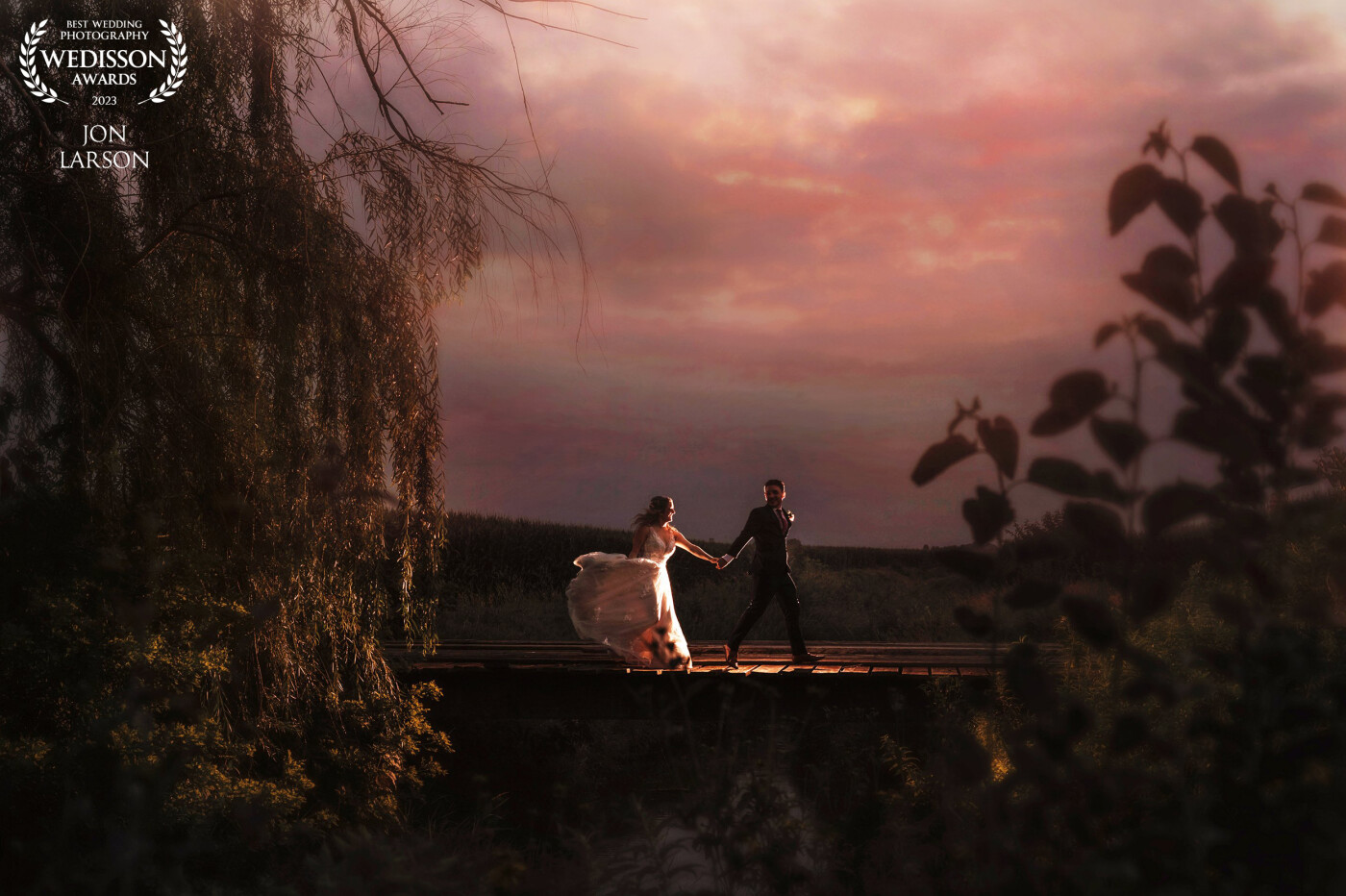 This couple was so much fun! A bridge tucked back in some woods and a field. I asked the couple to run across the bridge as the sun set behind them.