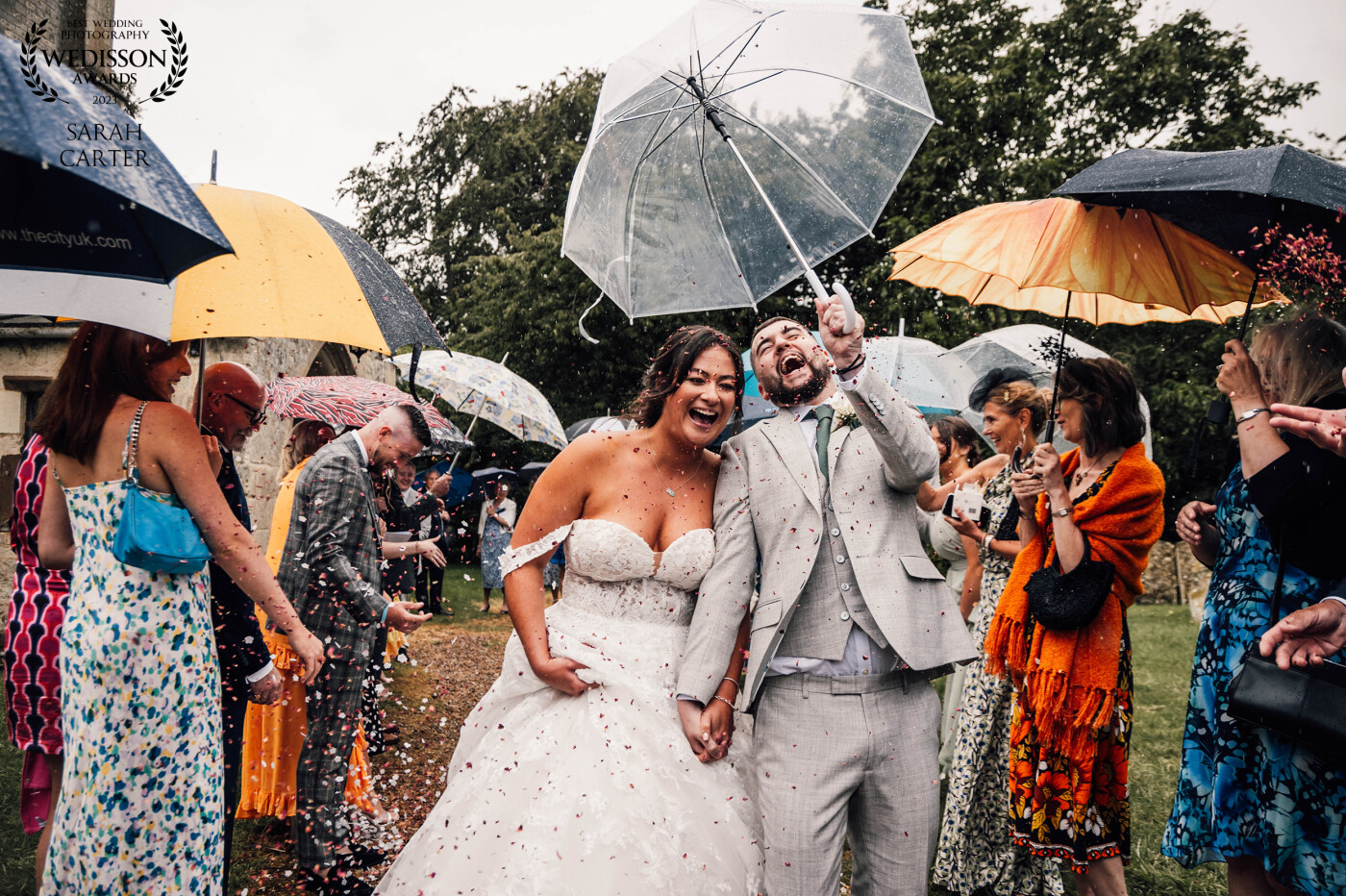 We left the church to a sea of brightly coloured umbrellas. Nothing was stopping us get a confetti shot. My gorgeous couple smiled all day.