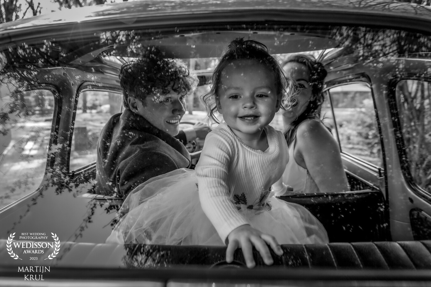 The connection between the bride and groom, as well as their precious daughter.<br />
The little girl playfully engaged with the camera, leading to this delightful result.