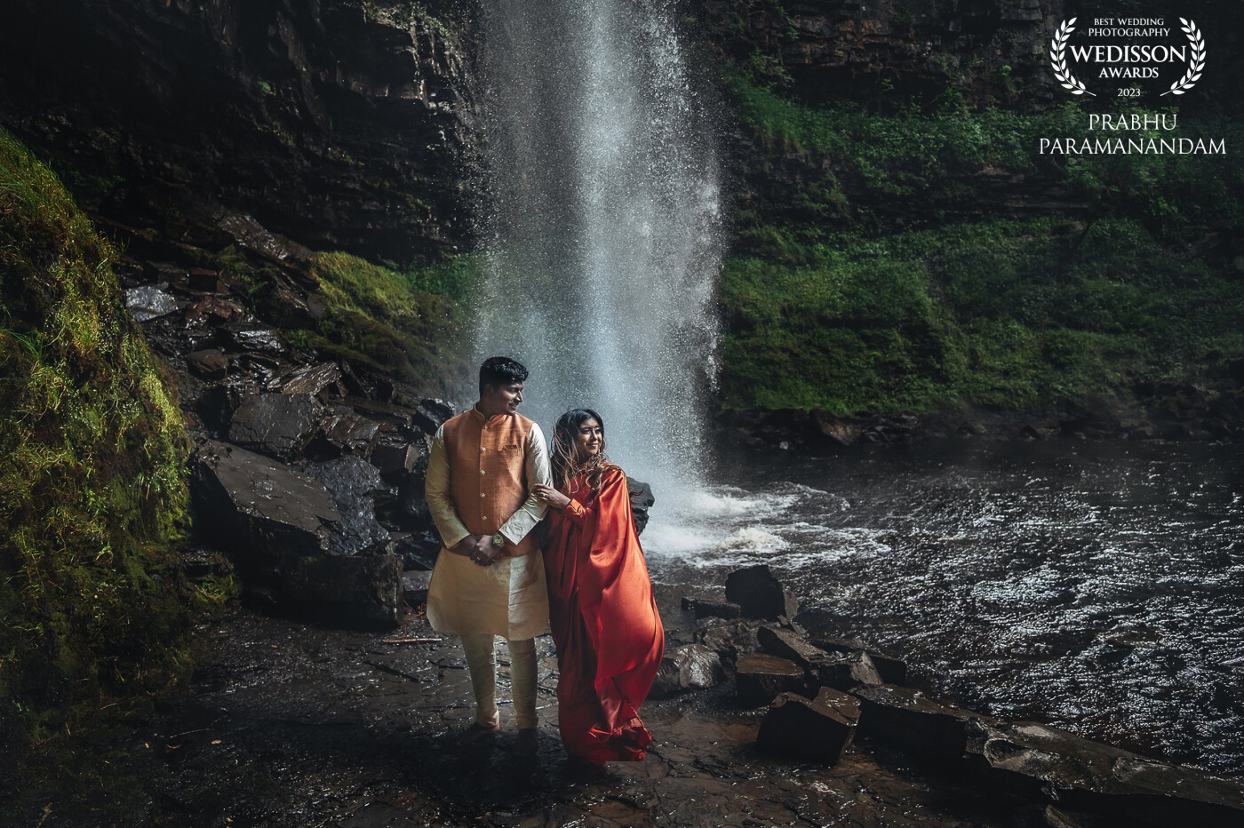 Set against this majestic waterfall cascading in style. The gusty wind, water drizzling, the frame was a stunner by itself. I knew the couple had to be part of this ethereal beauty.