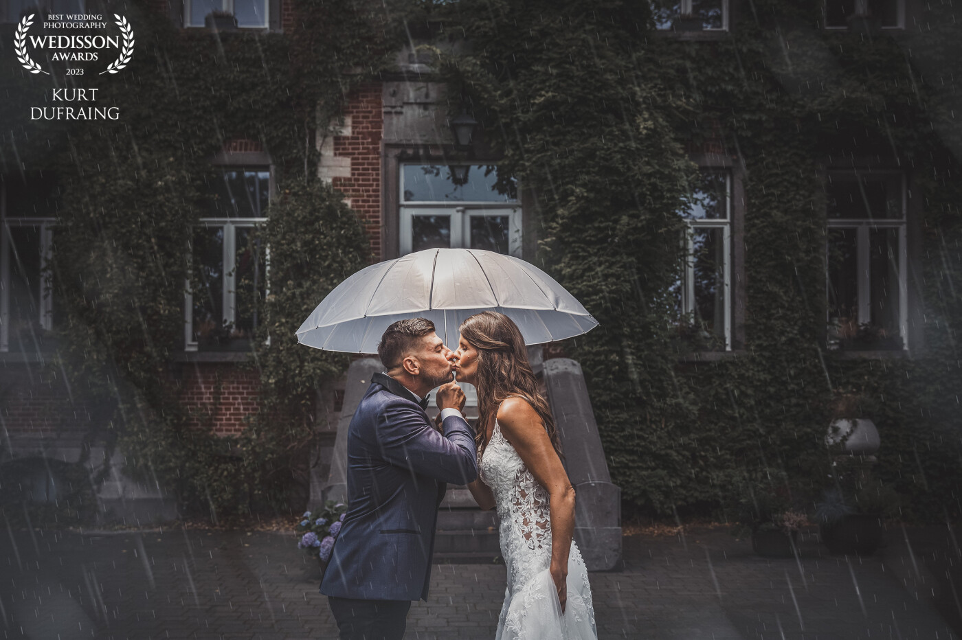 'Purple rain' would be an appropriate song for this photo. Rain can be very beautiful in a photo, especially if the couple continues to shine!