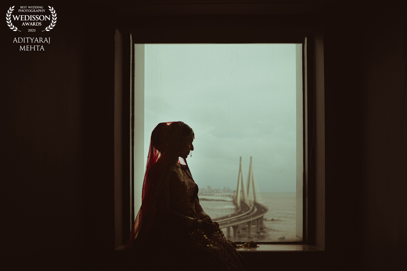 Ritika was one of the most poised brides we've ever photographed yet.<br />
<br />
We thought this image is a great metaphor for her personality, much like the ocean is in constant motion and chaos, the bridge across it just brings a sense of calm and stillness to it.