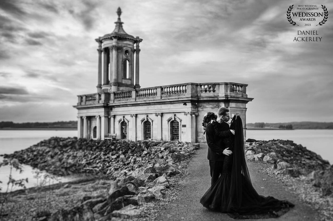 The moody skies over the stunning Normanton Church was the perfect backdrop for a romantic photograph of Odile & Sam at their Gothic themed wedding.