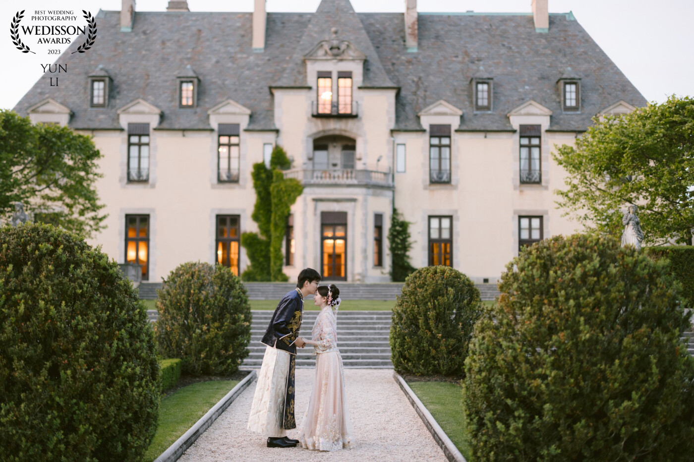 Bride and groom were wearing Chinese wedding outfits for their traditional Chinese wedding ceremony at the iconic wedding venue Oheka Castle in Long Island, New York.
