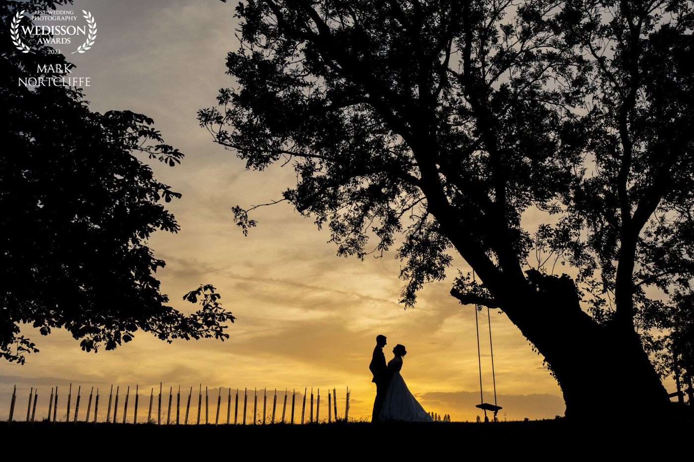 This shot was taken at The Granary Estates in Newmarket here in the UK. Sasha & Adam trusted me enough to pull them away from their wedding guests and their wedding breakfast to get this shot. The sky was just perfect. I'd visualised this shot earlier in the day and prayed for the right balance of conditions to achieve it. I think we won on the day. Thank you to my couple and to Wedisson for the award. Win Win situation.