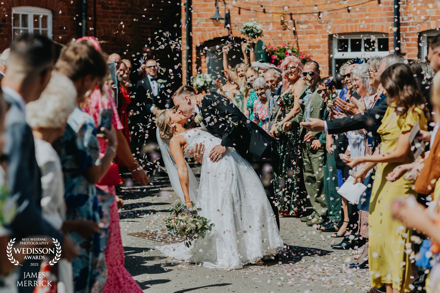 Not only was this an epic blizzard of confetti for Annie & Sam, but to stop and do a dip & kiss just sealed the shot!