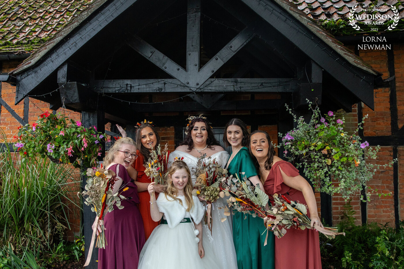Autumnal vibes! loved Caroline’s & Jacks pops of colour throughout their wedding day, the colours were just perfect for this time of year. all the bridesmaids had different coloured dresses and it worked so well. <br />
<br />
I love creative weddings that bring out the couple's personality, and have some fun with the group shots; they don't have to be boring. Congratulations Caroline’s & Jack.