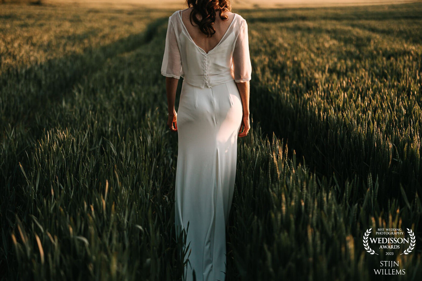 What can I say more. The light was perfect and the bride was walking towards the spot for our shoot, her dress was rippling against the grass and just a perfect photo.