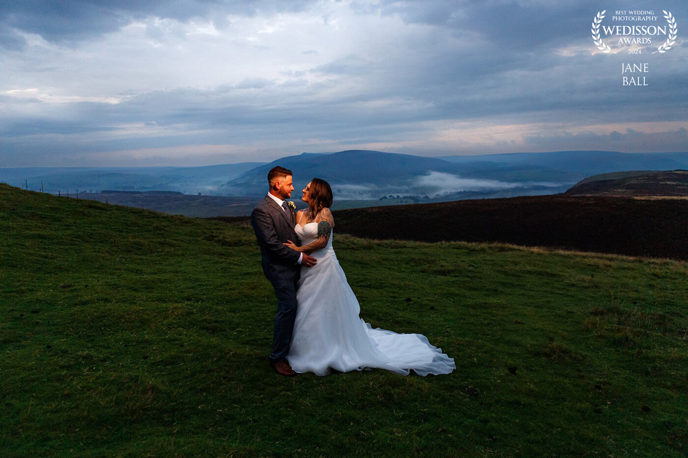 This was a beautiful twilight wedding at The Priests House and Old Chapel in Yorkshire. My couple wanted some dramatic portraits and as it had rained most of the day with the odd rumble of thunder, when the mist came rolling in I knew we just had to drive out onto the surrounding moorland. Using off camera flash to light the couple I underexposed the scene to bring even more drama to the background. When I saw the resulting image on the lcd screen I knew I'd got something special.