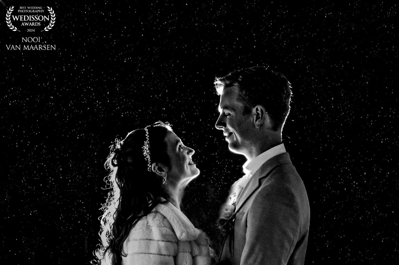 During the group photo’s at this winter wedding at kasteel woerden, the Netherlands it started raining heavily. Luckily this beautiful couple didn't care about the rain. And I was excited too. Rain is a great addition to a photo. So if you ever have rain on your wedding day? Don't worry a good photographer always knows what to do with it and will get excited seeing it.