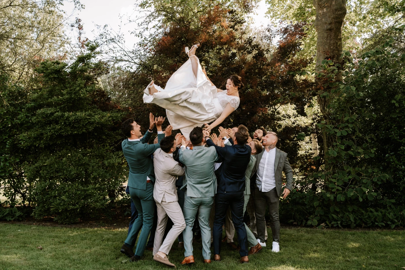 I asked some of the men to throw the bride in the air. We both did not expect she would be thrown th...