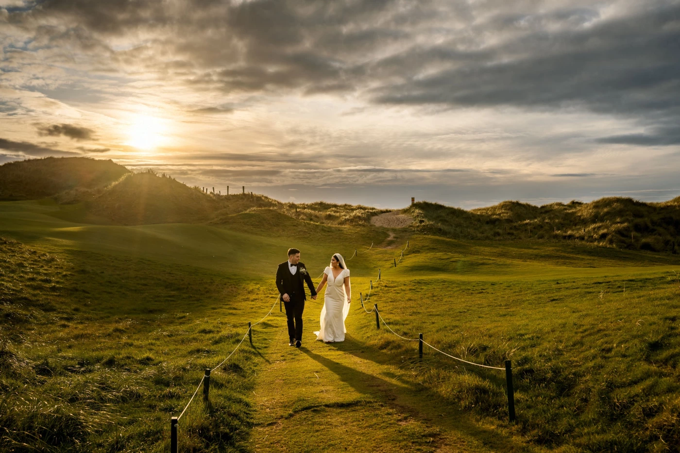 Couple photo session on the stunning beaches of Ireland, featuring the magnificent Trump Internation...