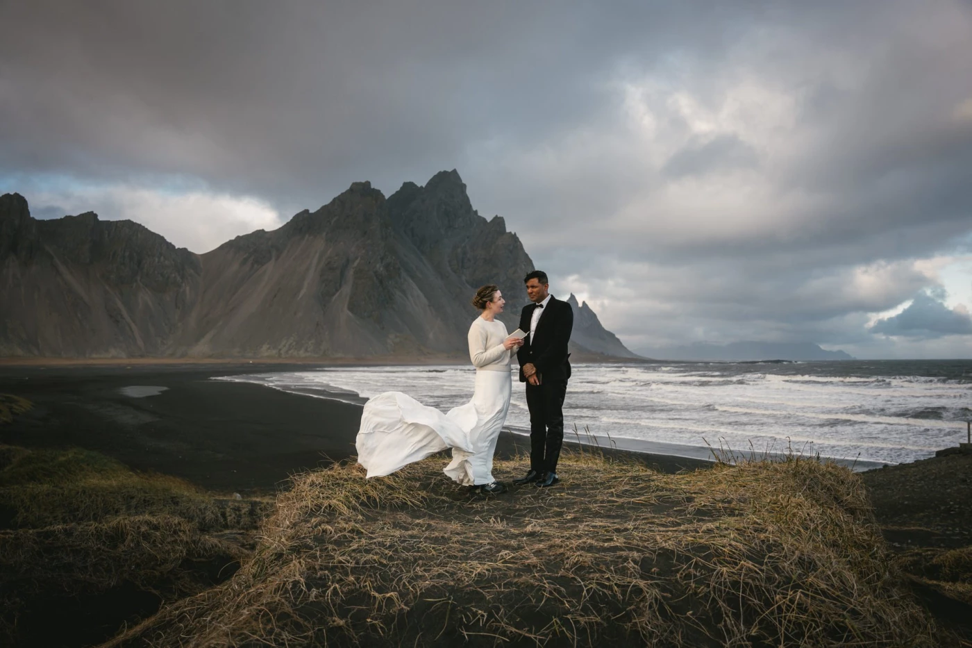 Set against the strikingly moody backdrop of Vestrahorn, Iceland, this couple embraced the raw power...