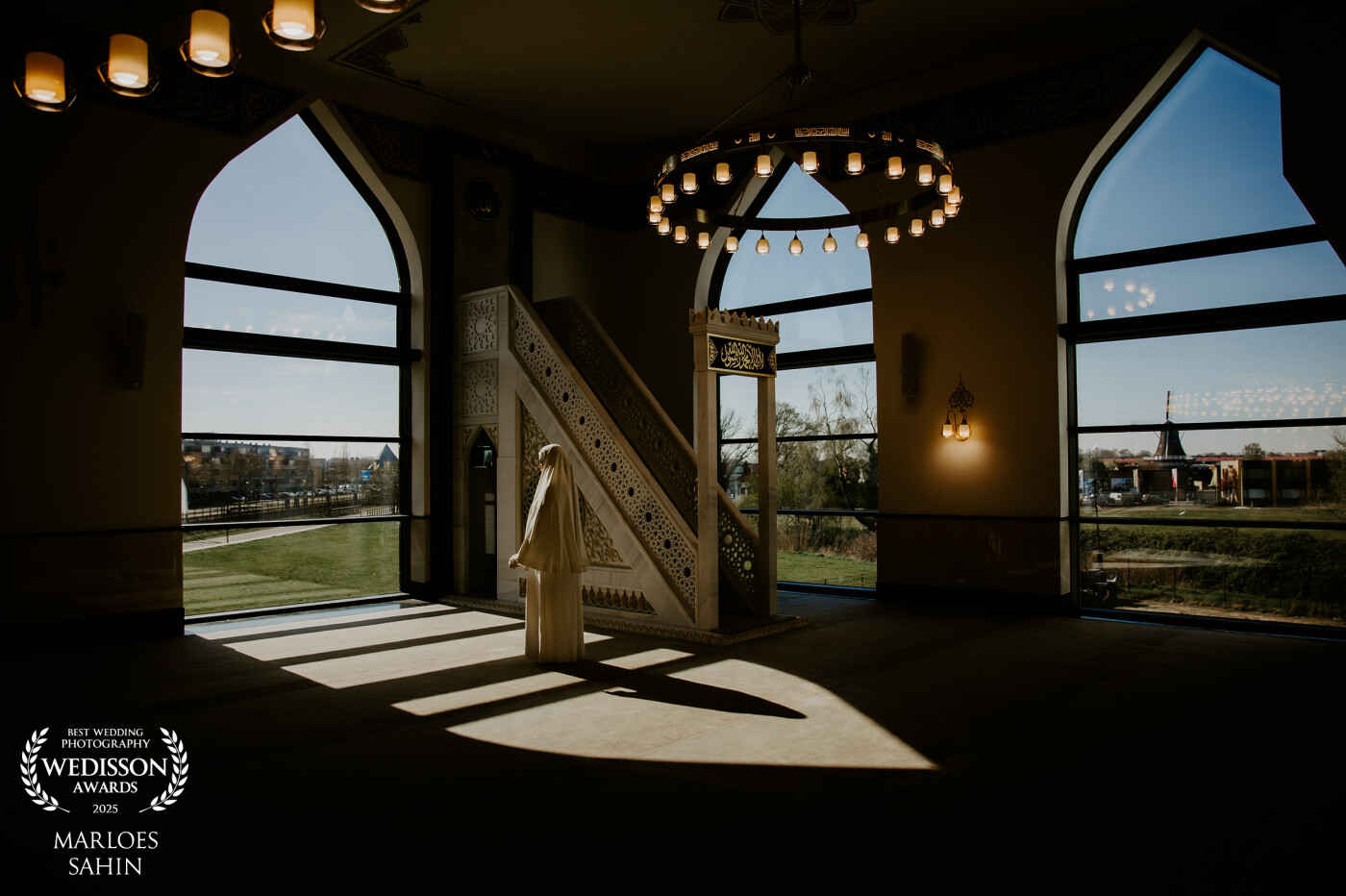 i am in love with this picture! the light is perfect and I love to take pictures that have a cultural feeling. This is taken in a mosque with a dutch mill in the background. the multicultural society.