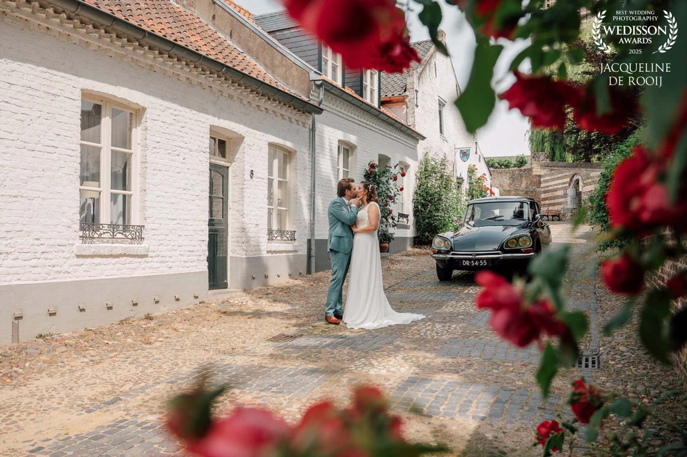 "Long live spring, the season when everything grows and blossoms. I saw these beautiful flowers and wanted to give them a place in the photo with this lovely couple and their cool car in the white town of Thorn."
