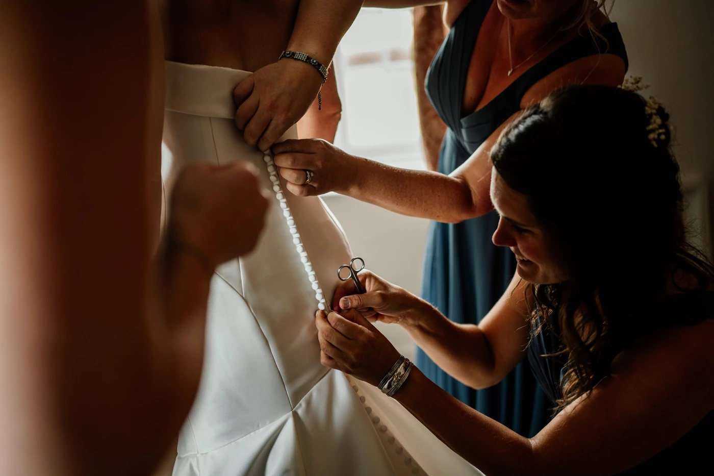 REBECCA & JAMES

I adore this 'action shot' of Rebecca's bridesmaids helping her get into her dress....